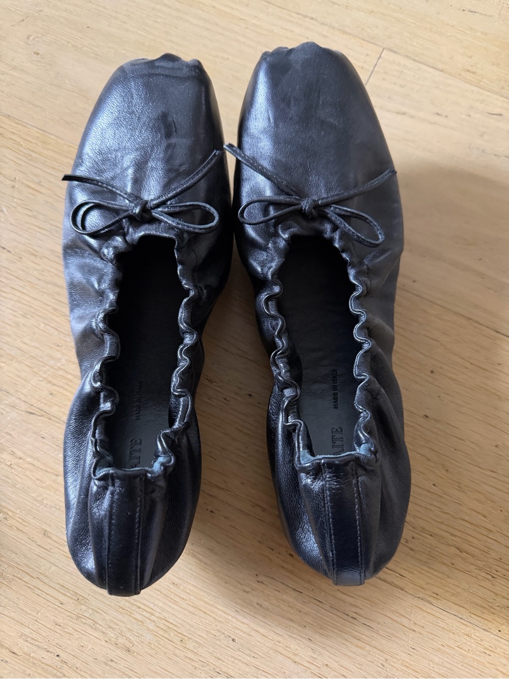 KHAITE Black Leather Ballet Flats with Bow Detail